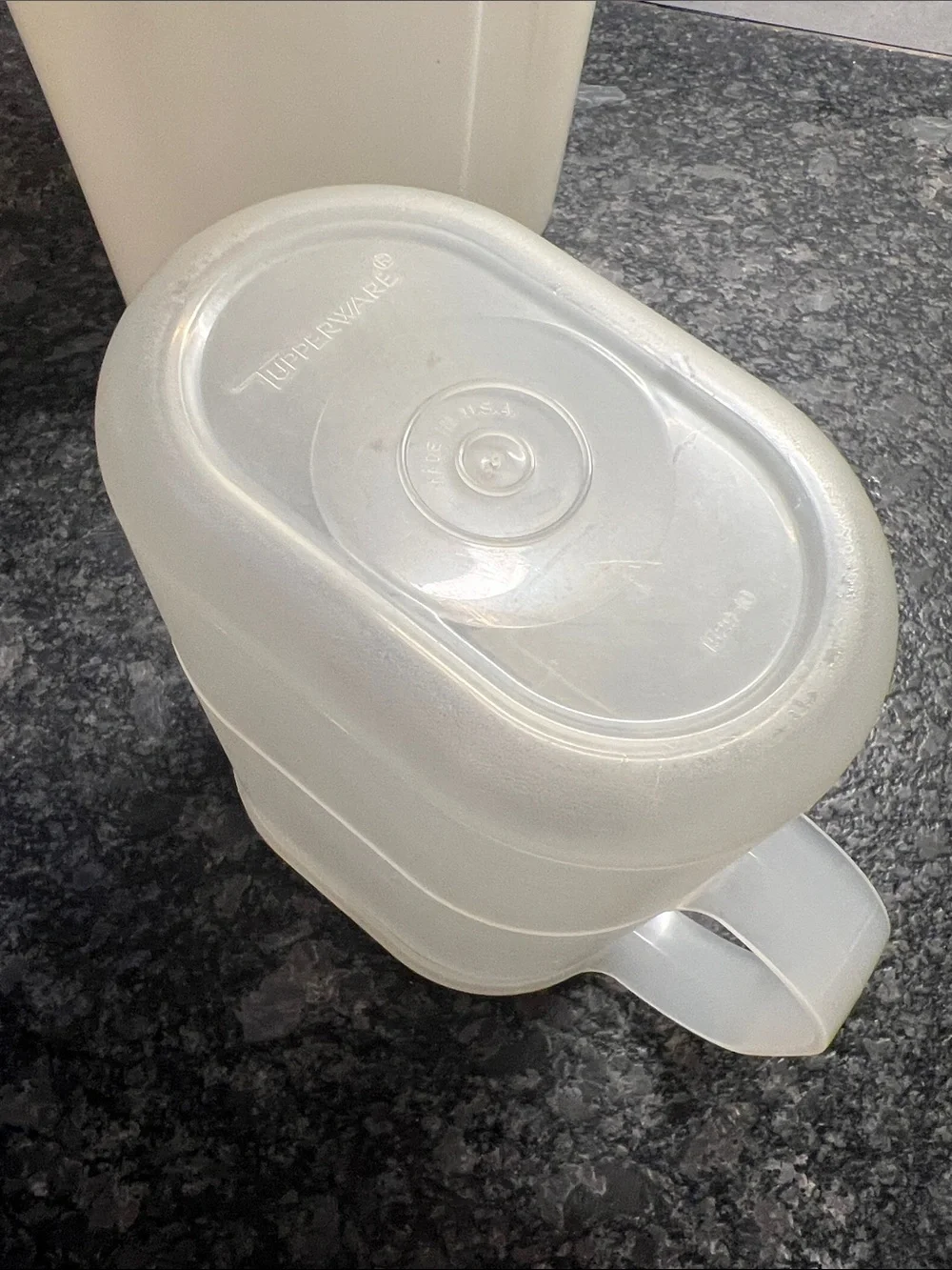 Tupperware 1 qt and a 2qt slim line beverage containers. Semi sheer Tight spaces